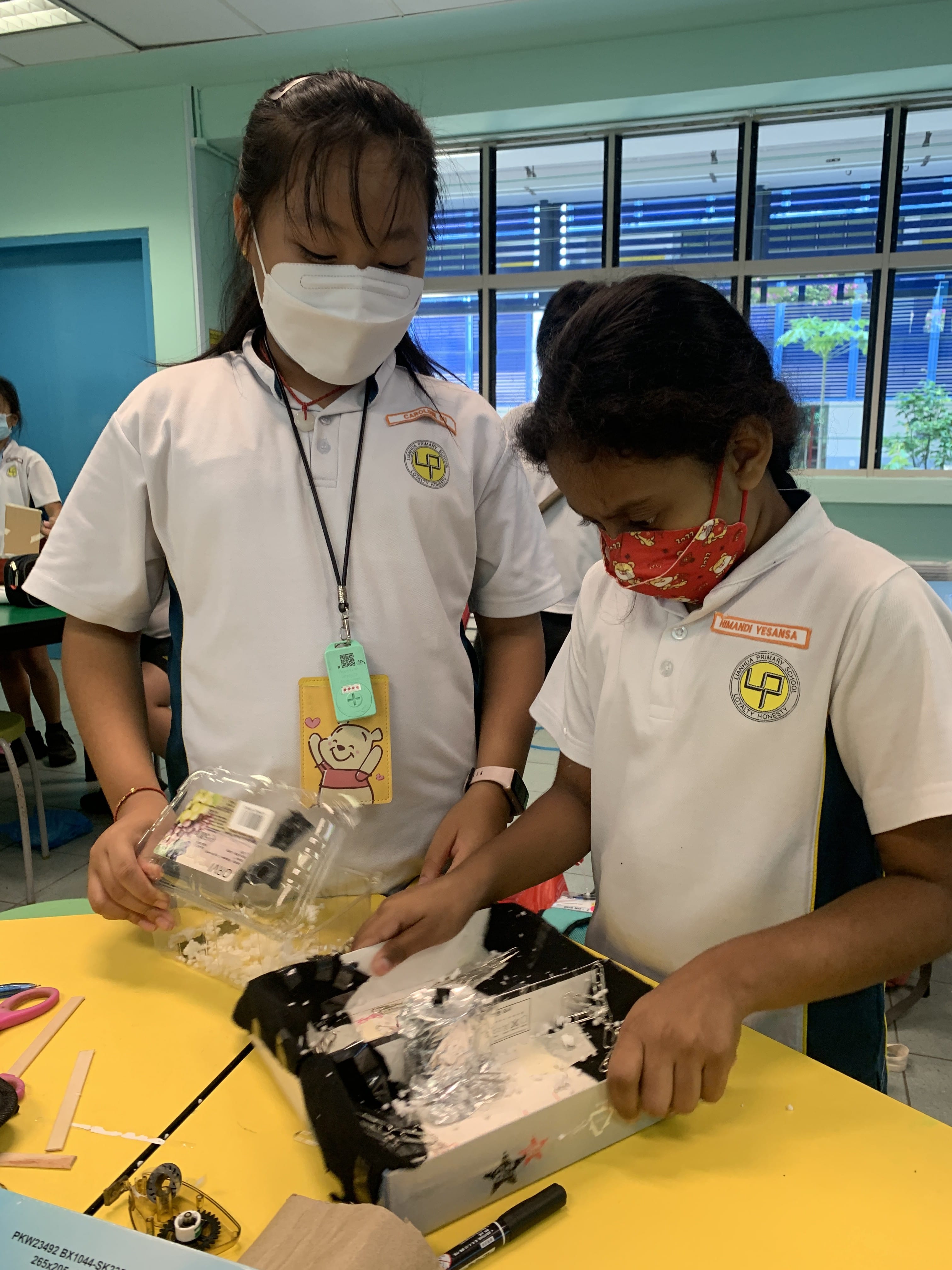 Two girls making their prototypes